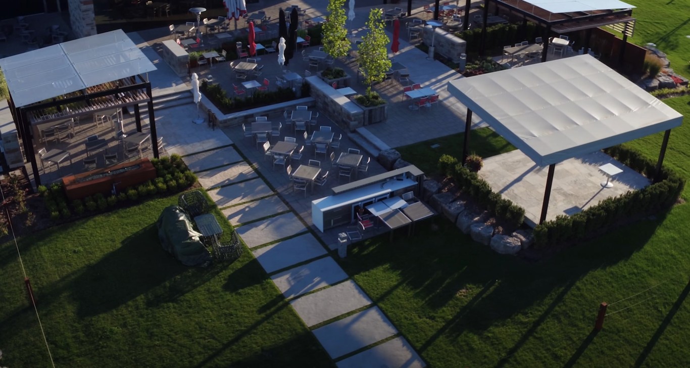 Contemporary outdoor entertaining space with modern patio and landscaping in Doral, FL